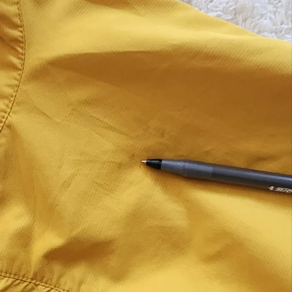 The North Face Flight SerieYellow and Gray Windbreaker.